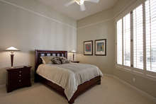 Bedroom two with en suite bath and private door to courtyard and pool.