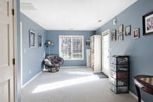 A carpeted bonus room on the entry level provides great versatility; it could serve as a home office or playroom. A glass doors leads to the backyard. 