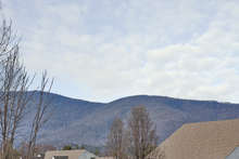 Panoramic mountain views are around every corner in the Highlands at Mechums River community. This neighborhood offers true country living and a pastoral environment without sacrificing easy access to Charlottesville. 