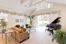 Cross courtyard to enter home into spacious living room...