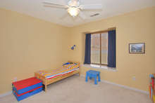 Both bedrooms have views of the peaceful Mill Creek South neighborhood. They also feature closets and ceiling fans. 