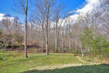 A state park right outside your back door! The grassy lawn leads to Biscuit Run, giving you unbeatable access to endless acres of woods & trails. 
