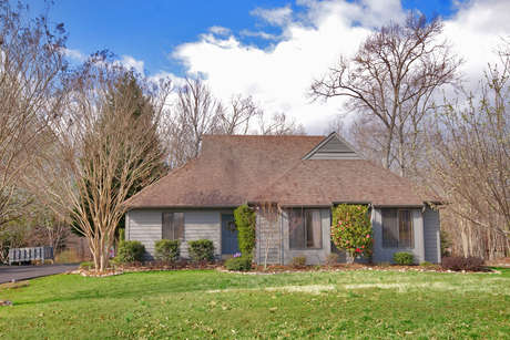 Welcome to 1540 Stoney Creek Drive. This contemporary in Mill Creek South is a real beauty, with cedar siding & a landscaped yard that backs to Biscuit Run State Park-allowing you to step out your back door & into acres of natural park like terrain