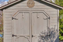 This charming shed in the backyard has recently been wired for power and electricity and makes for great workshop or gardening space. 